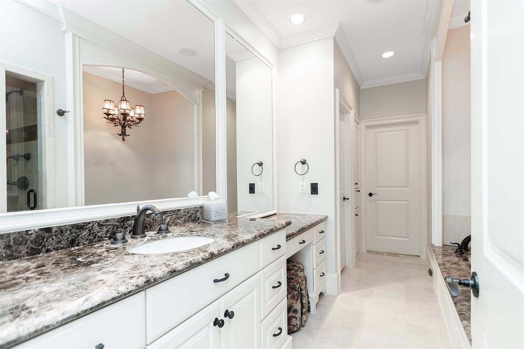 Enjoy the luxury of an en-suite bath just a few steps away from your bedroom. The master bath is graced by granite countertops, generous storage space under the sink, and large mirrors.