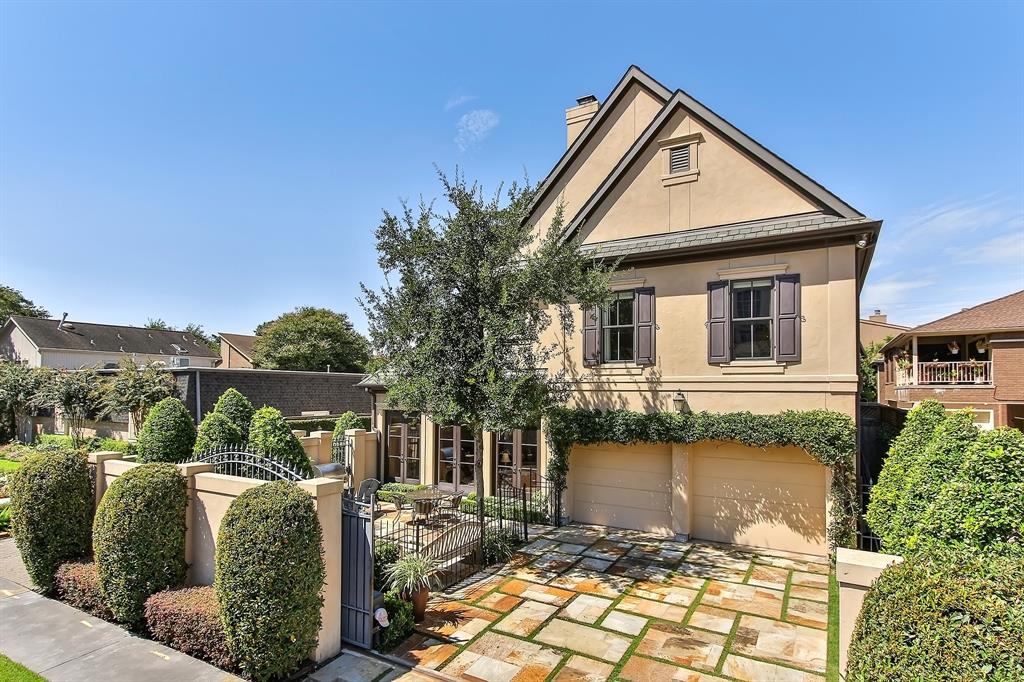 The pool and patio are accessible from the attached two-car garage, which is located behind the home.