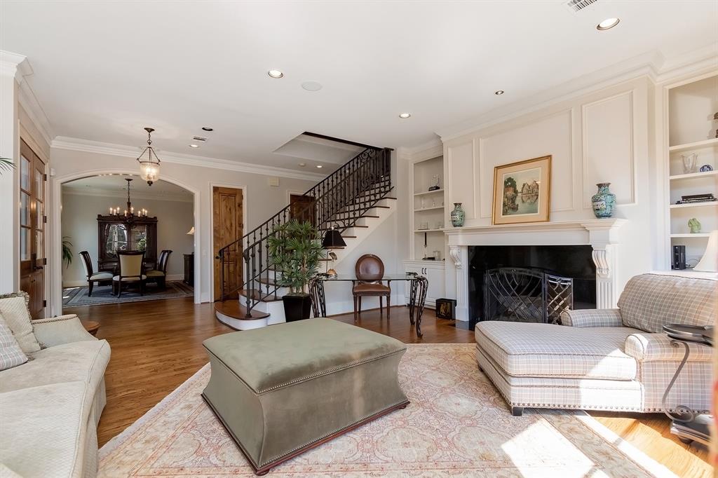 Expansive formal living has enough space for a couch and coffee table cushion as well. The formal dining is visible in the background.