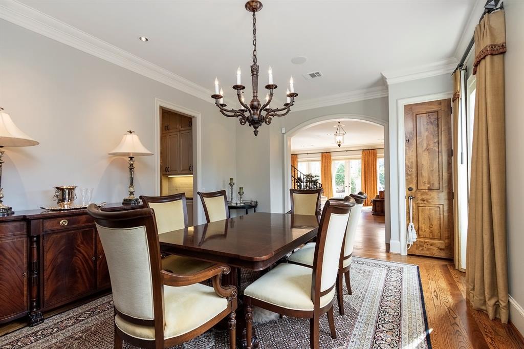 The formal dining can accommodate larger pieces of furniture such as a dining table and chairs for six people, two standing dressers, and a side table.