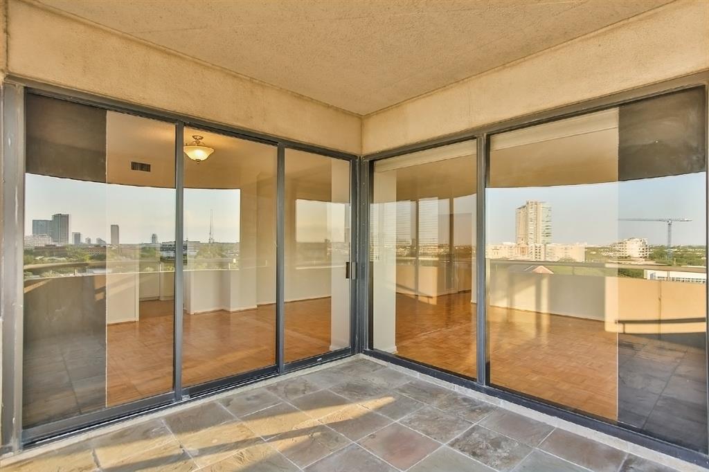 Sliding doors from the balcony open to the living area and dining room, emitting natural light and fresh air inside the unit. This luster enhances the overall ambiance and sophistication of the place.