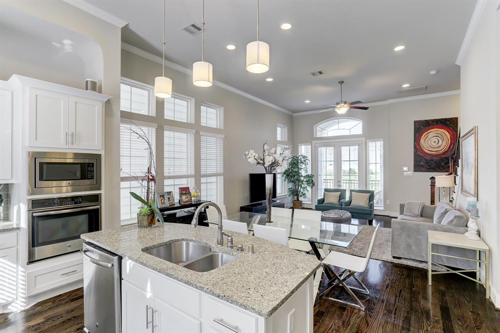Under the stunning granite-topped island are the drawers, which provide additional room for your tableware and spices, and a dishwasher, which makes life a little bit easier. All practical aspects have been meticulously placed into the design of this kitchen with plenty of space to chat and entertain your family and friends.