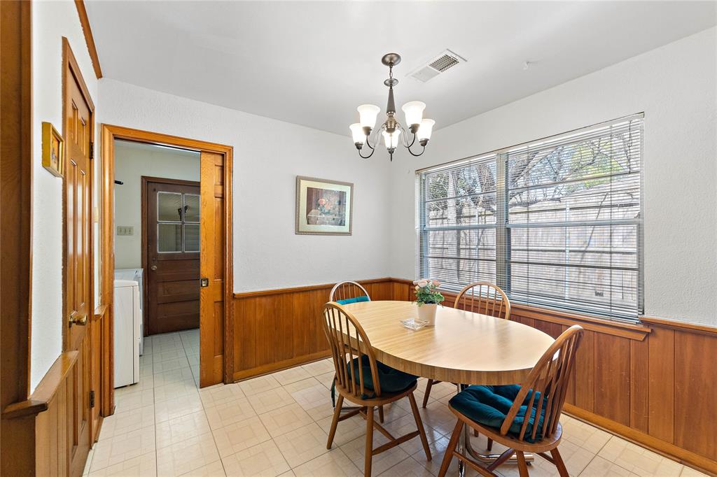 An intimate breakfast room is perfect for daytime discussions or serene afternoon tea. Enjoy warmth and solace in this alluring corner. Behind the hardwood sliding door is an easy-access laundry room that offers utmost expediency.