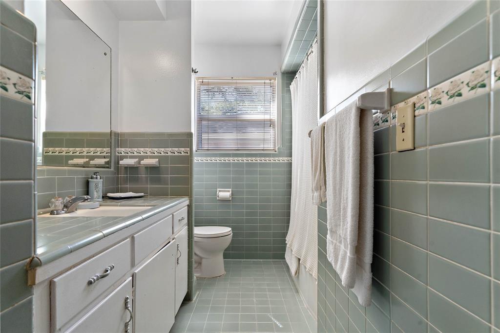 An additional bath between two of the three secondary bedrooms maximizes the comfort of this meticulous home. The tile floors extending up to the walls trimmed with floral detailing complete the exquisite vibe.