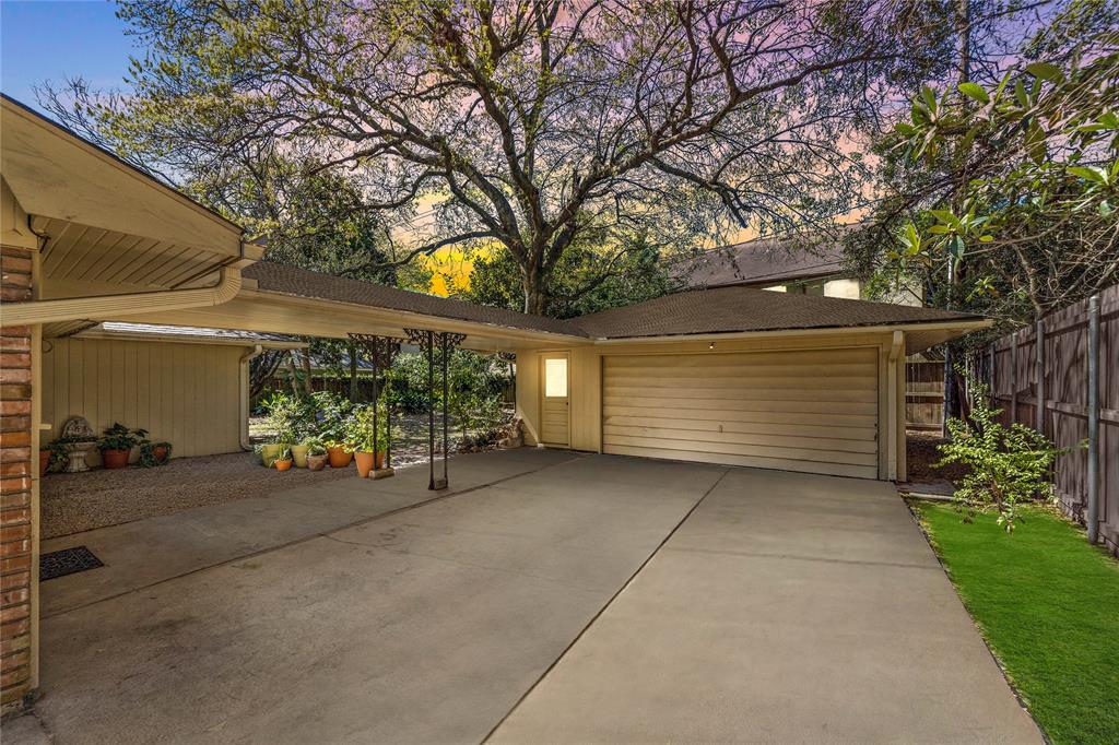 The wide driveway leads to an enclosed garage to protect your vehicle and belongings while giving you the option for indoor and outdoor parking.