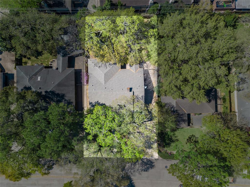 This aerial shot of 2402 Chimney Rock shows the wide reach of the vast property and perfectly displays the privacy of its extensive lot.