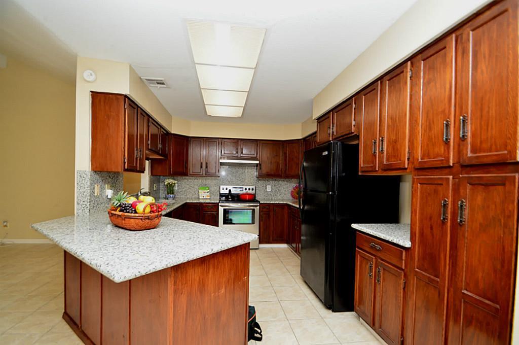 Nicely Updated Kitchen with Granite Counter & Backsplash, Electric Range, Dishwasher, Disposal & Refrigerator is Included!