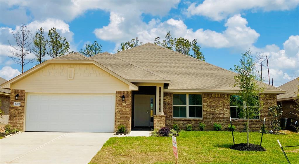 Welcome Home to 30140 Kingston Heath Dr. Lovely Brick Craftsman style elevation