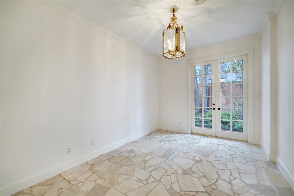 Photo #8 This first floor bedroom leads to the lush patio space and offers a spacious walk in closet.