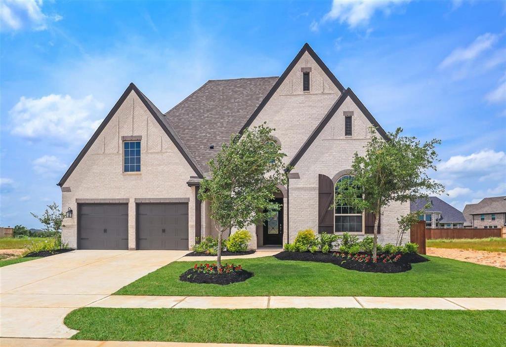 2619 Open Prairie Lane Katy, Texas MLS# 66508274 - Built by Highland Homes - Ready Now! ~ This home has it all! Gorgeous spiral staircase in foyer area, two story family room, grand floor to ceiling fireplace, 8 foot windows throughout family room and kitchen that brighten up the home! Grand outdoor patio that is perfect for entertaining guests! Separate formal dining area, private study, true media room upstairs, separate game room, and gorgeous hardwood flooring throughout main level of home! Don't let this home get away, come check it out today!!