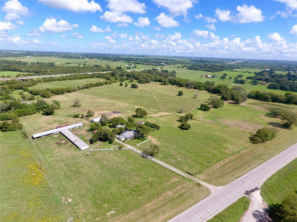 2741 W US Highway 90 Schulenburg, Texas Once in a lifetime opportunity to own land a mile from the Schulenburg city limits. This 41 acre tract sits in a highly desirable area of Fayette County, and has 1,900 feet of West Navidad River frontage! The large homestead house sits on top of a hill overlooking the river bottom and is ready for your opportunity to remodel and make it your own! Property is fenced and cross-fenced and is ready to run cattle, cut hay, or do a little hunting! Mature Oak and Pecan trees are dotted along the pasture and river frontage. Don't miss your chance to build your dream home either, as the homestead site has a wonderful view overlooking the river. House, improvements, and surrounding area, 3.67 acres, are not in the floodplain according to completed elevation study.
*Disclaimer, according to FEMA maps, this property is in the FEMA floodplain.*