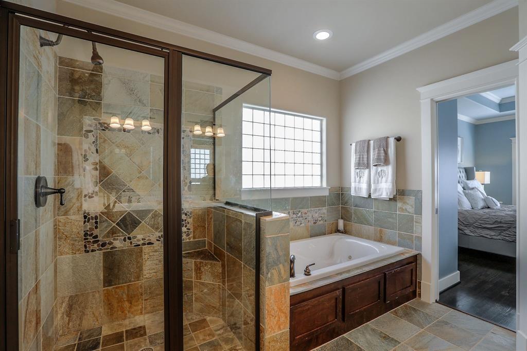 The master bath features a large shower with separate jetted tub. The master suite also features a large, walk-in closet.