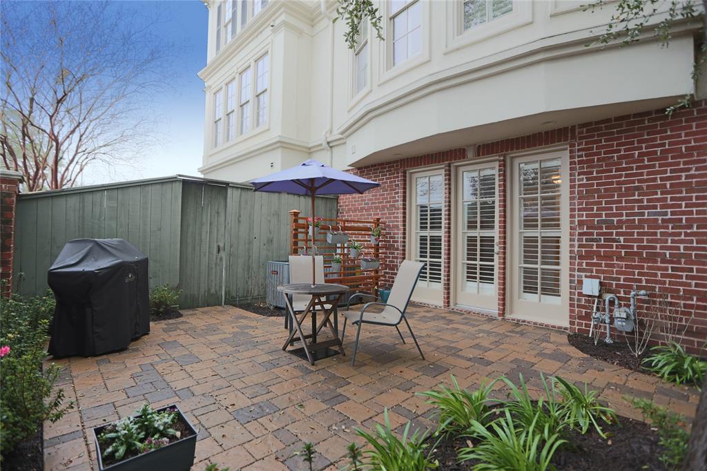 2522 South Boulevard A Houston, Texas Light and bright upscale townhome within walking distance to the Rice Village. Interior features travertine floors, wrought-iron railings, crown molding, and plantation shutters. Hardwood floors in living and dining areas, as well as in the two upstairs bedrooms. All bedrooms have walk-in closets, with the master suite having two including one that is almost bedroom-sized. The master bedroom also features a vaulted ceiling, huge master bath, and a balcony. The gourmet kitchen has stainless steel appliances and beautiful granite counter tops. The dining/living combo provides a wonderful entertainment area, as does the back patio with its recently redone flagstone. Recent interior paint, brand-new carpet in the first-floor bedroom, and a dryer purchased in February 2019 (Washer, Dryer, Refrigerator all remain). AC unit for upstairs replaced in 2018, with rest of the HVAC system replaced in 2013. Come and see this jewel today!