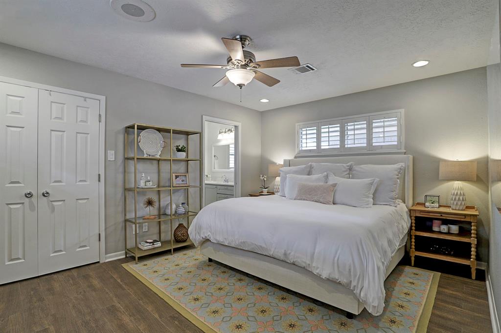 Spacious master bedroom is nestled in the back of the home. Wood-like tile is carried throughout the home. Double doors lead to walk-in closet. Two windows in the master.