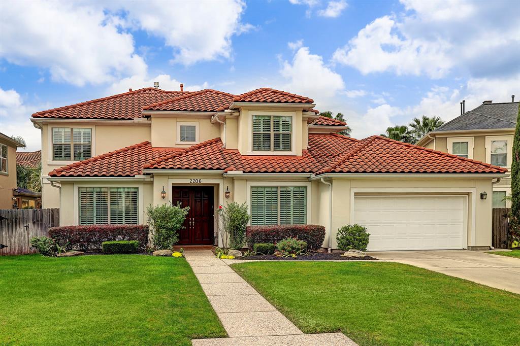 2206 SUMMERBLOSSOM Lane Houston, Texas Gorgeous Mediterranean dream home with magnificent stucco front elevation and tile roof nestled at Lakes of Parkway manned gated community. Second to None location! Fabulous residence offers an excellent layout with lots of amplitude. Greeted by a two story foyer with an abundance of natural light, wrought iron staircase and high ceilings. Home features sought after open layout with living room and kitchen overlooking the backyard which is beautifully landscaped. Simplicity of beauty brings luxury to every room of this property. Features 4 bedrooms, Mater Suite Retreat downstairs with sitting area, formal dining area, study with wall of built ins, living room with splendid views of backyard, marvelous kitchen and breakfast area and a 3 car garage. At second level it offers 3 bedrooms and a very spacious game room. Backyard is wonderfully landscaped to attract butterflies with a mix of fragrant, bold and colorful flowers.... ample space to add your own style pool.