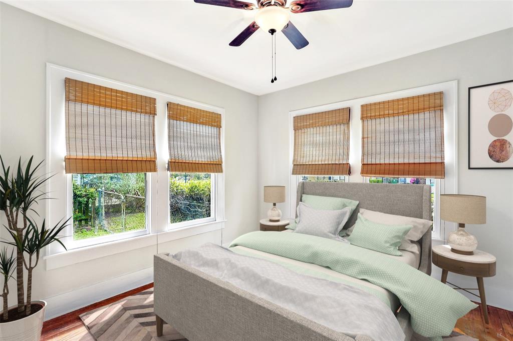 Front bedroom also includes the hardwood floors, a ceiling fan, and tons of natural light. Either of the secondary bedrooms could double as a study or guest bedroom. This image has been virtually staged to provide you with a possible lay out of this great guest bedroom.