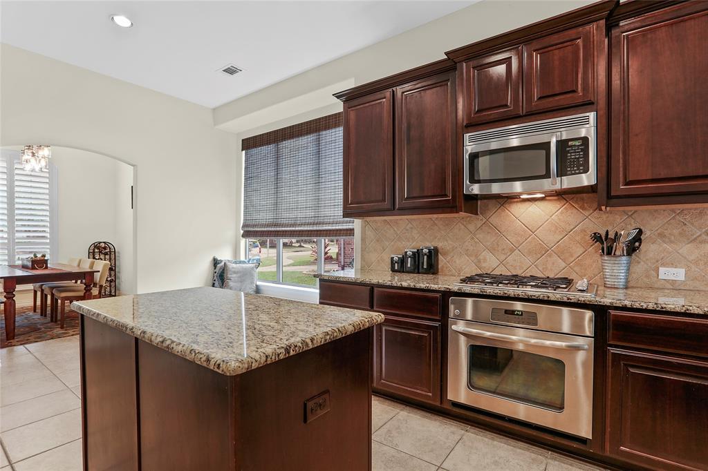 Stainless steel stove and microwave. Upgraded granite countertops.