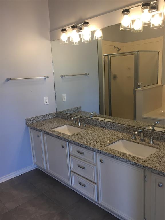 Master Bath with granite countertops and double sinks