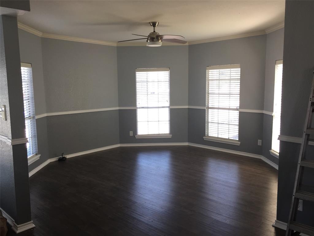 Living Room with tons of natural light and new ceiling fan