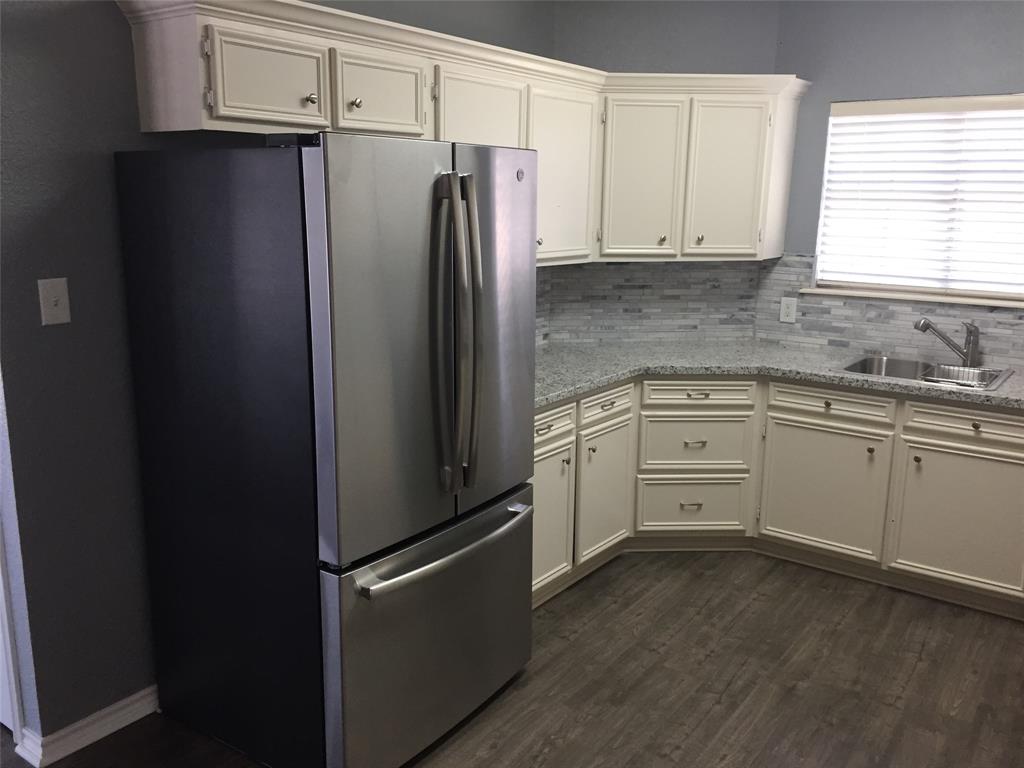 Kitchen with granite countertops and new appliances