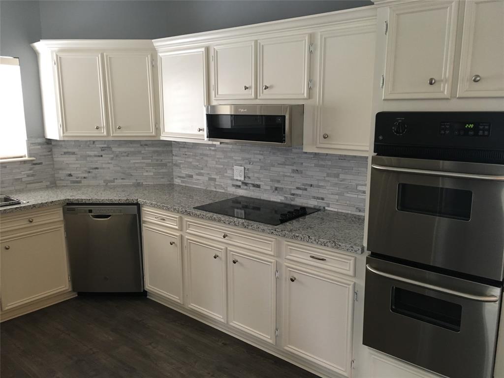 Kitchen with granite countertops and new appliances