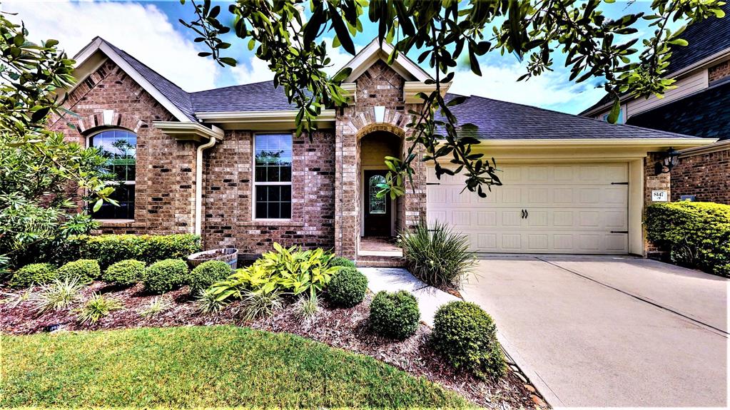 8147 Little Scarlet Street Conroe, Texas The ideal home you were looking for in a gated community, located just minutes from I-45, Woodlands Mall, Parks, grocery stores, restaurants and much more. This home features amazing Wood Floors, tile in kitchen and bathroom, stainless steel appliances, granite countertops, large backyard and covered patio for entertainment. This is a MUST SEE home in the Woodlands!