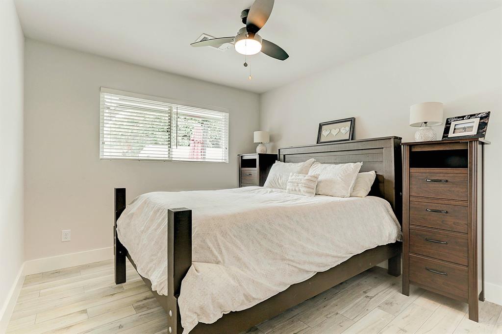 Guest bedroom filled with natural light and finishes to match the rest of the home.