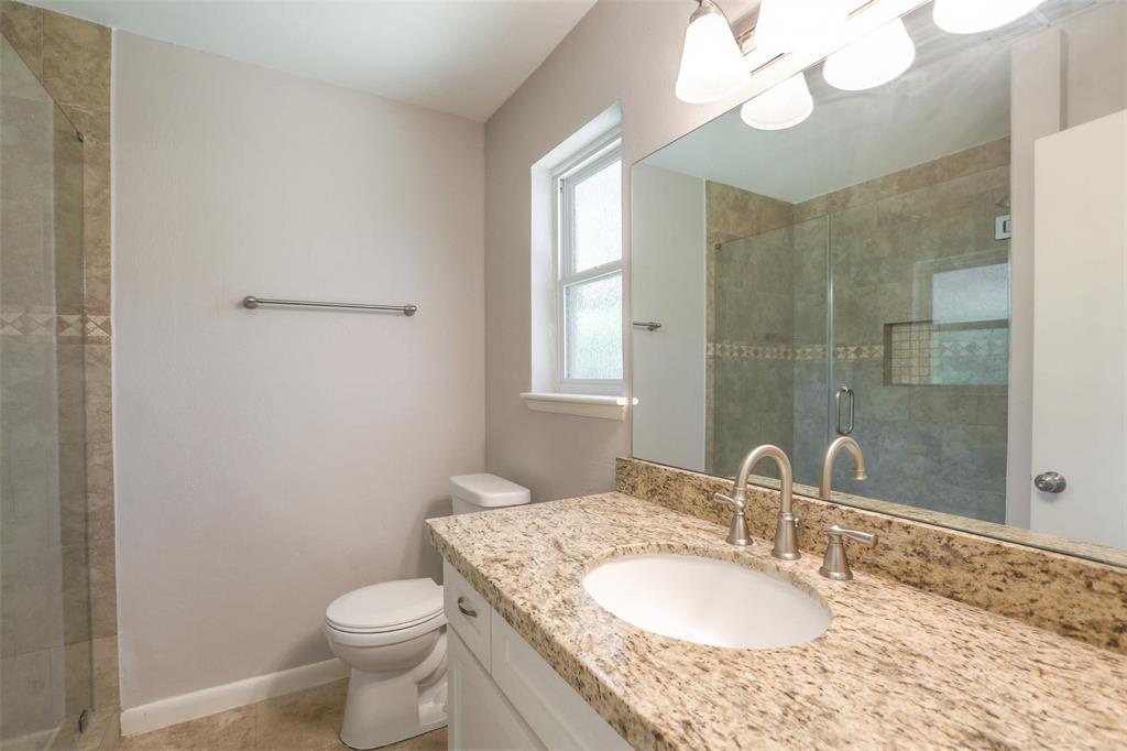 Master bath with granite counter top and updated shower.