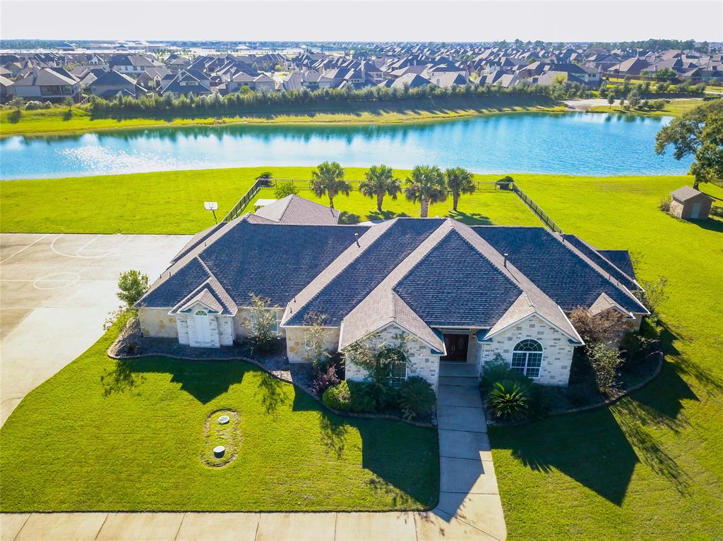 3034 Ginter Lane Katy, Texas Move-in Ready! Welcome home to a delightfully remodeled home in Woodlake Estates. This home has a open floor-plan with high ceilings with plenty of regular lighting throughout. This unique home has formal living and dinning, in addition to a huge master bedroom and game room. This home is great for anyone with multiple drivers in the house hold or for someone who entertains a lot with the carport allowing additional parking. This home sits on an acre lot with water front views to include a pool and hot tub!! If you are someone who likes to enjoy your home with the feel of being on vacation, this is a must see! New Roof....