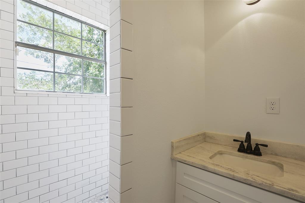 You're guests are going to love the convenience and charm of this great fully bathroom located just off the secondary bedrooms.  You're going to love the large, subway tiling enclosing this large shower.