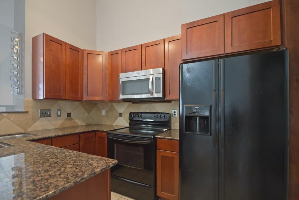 Kitchen features Granite Countertops. Refrigerator included with Home