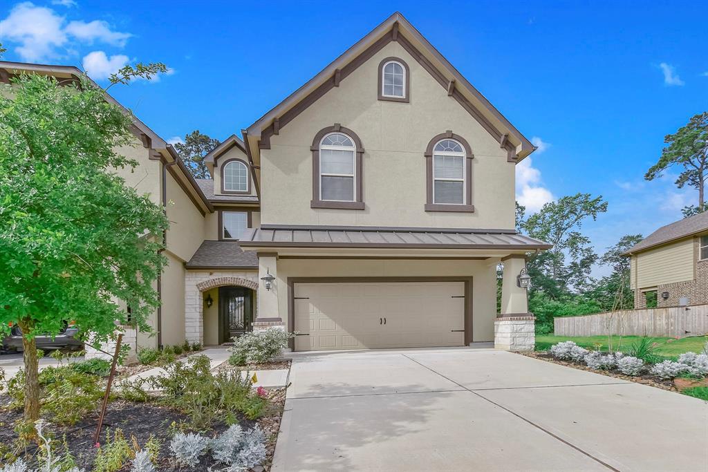 152 Skybranch Drive Conroe, Texas Beautiful Village builder Bordeaux plan. Fantastic townhome with dream gourmet island kitchen, clay glazed white cabinets and Frigidaire stainless steel appliances. Granite countertops throughout home. Wood floors downstairs. Luxurious master suite with vanity, corner tub, large walk-it closet and private covered balcony. Covered patio with pavers and 2nd balcony.