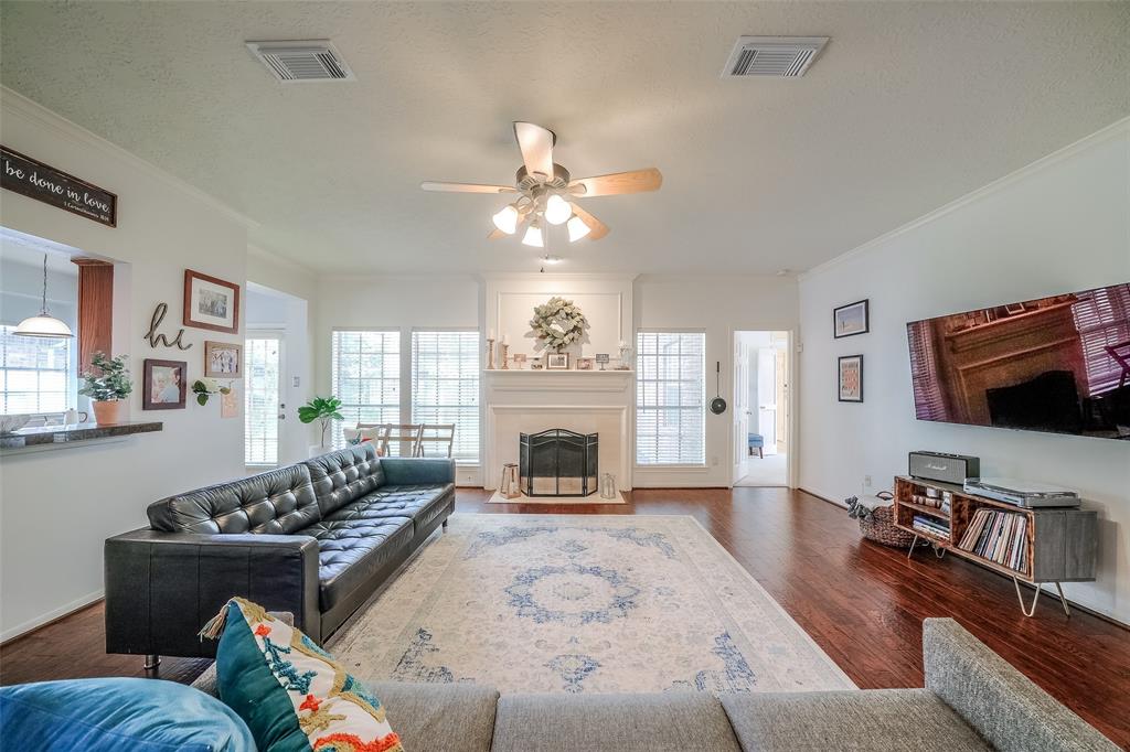 Very open family room is the heart of the home! Beautiful gas log fireplace is surrounded by windows that let all of the natural light pour in.