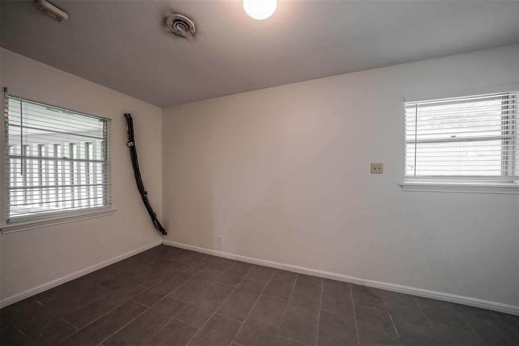 Huge laundry room with new tile flooring and paint.