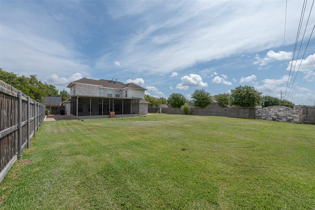 At the other end of this fenced in yard is a massive, screened-in back porch. The BIG and best is yet to come!
