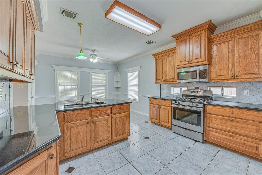 From kitchen to breakfast room to screened-in porch, this home is an entertainer's dream.