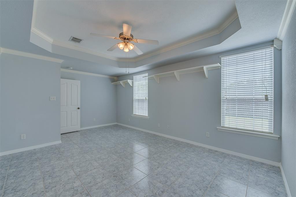 The master suite with its tray ceiling makes for a peaceful and private getaway.