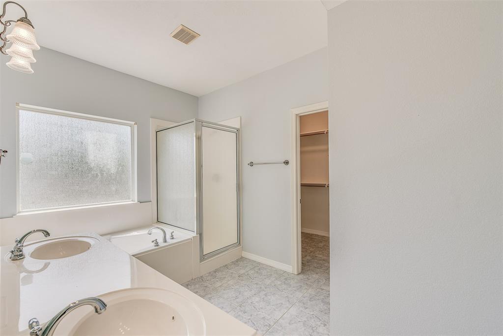 The master features an ensuite that is "suite" enough for two.
