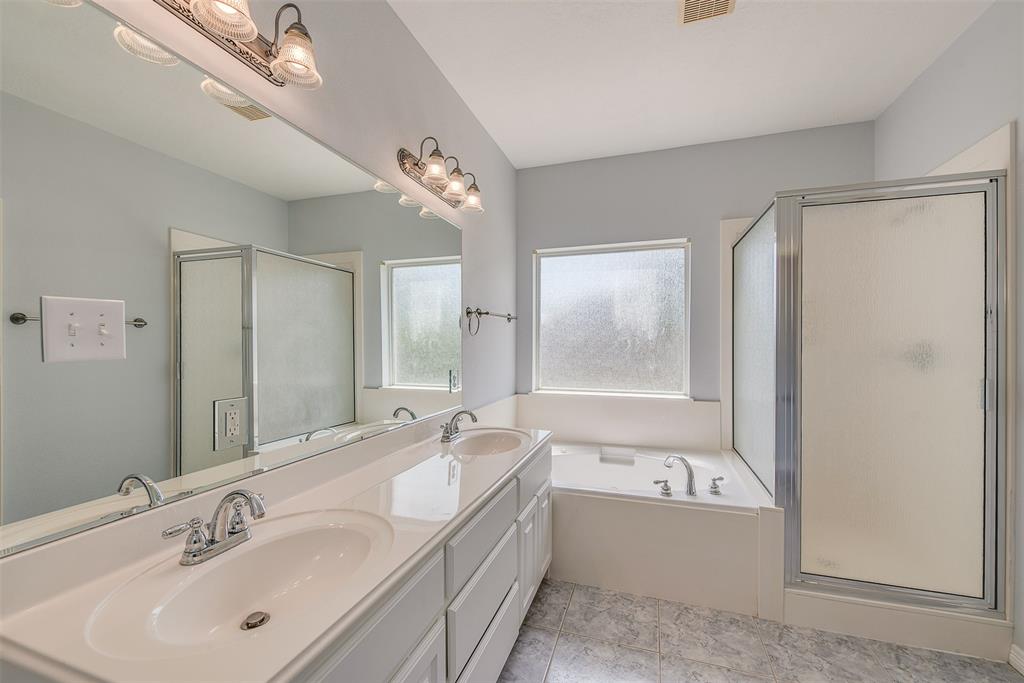 The master ensuite features dual vanities, a deep jetted tub and separate shower.