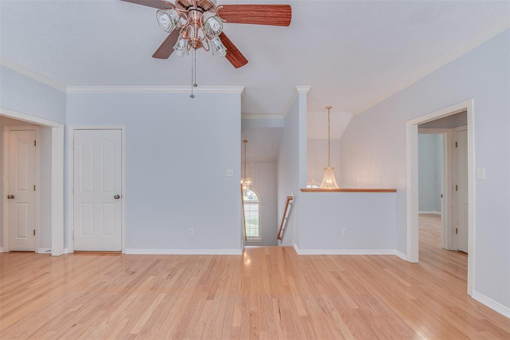The wood-floored upstairs, which features a game/media room that is flanked on either side by three total bedrooms and two full baths, makes it a rental game day getaway.