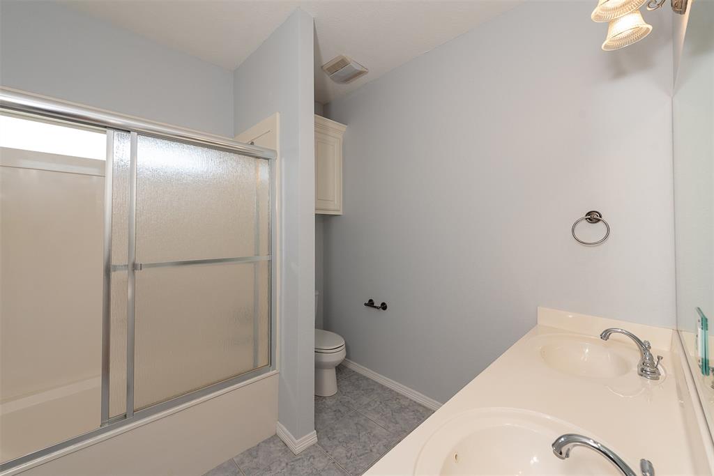 This bathroom is conveniently located between the front and back left-side bedrooms.