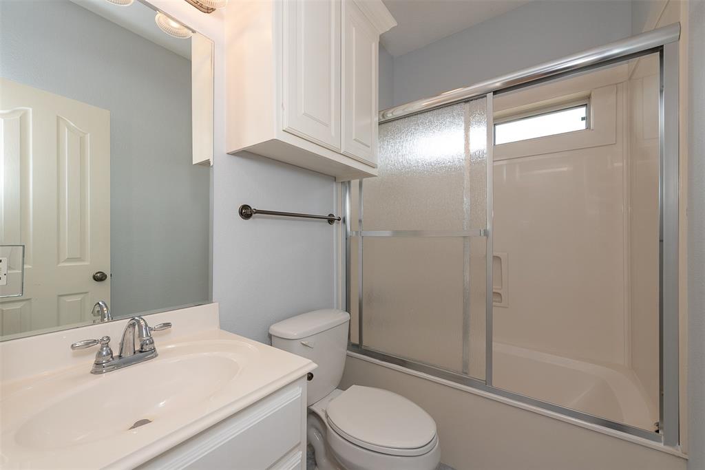 Just off the right side of the game/media room is a third full bath for a fourth and final bedroom.