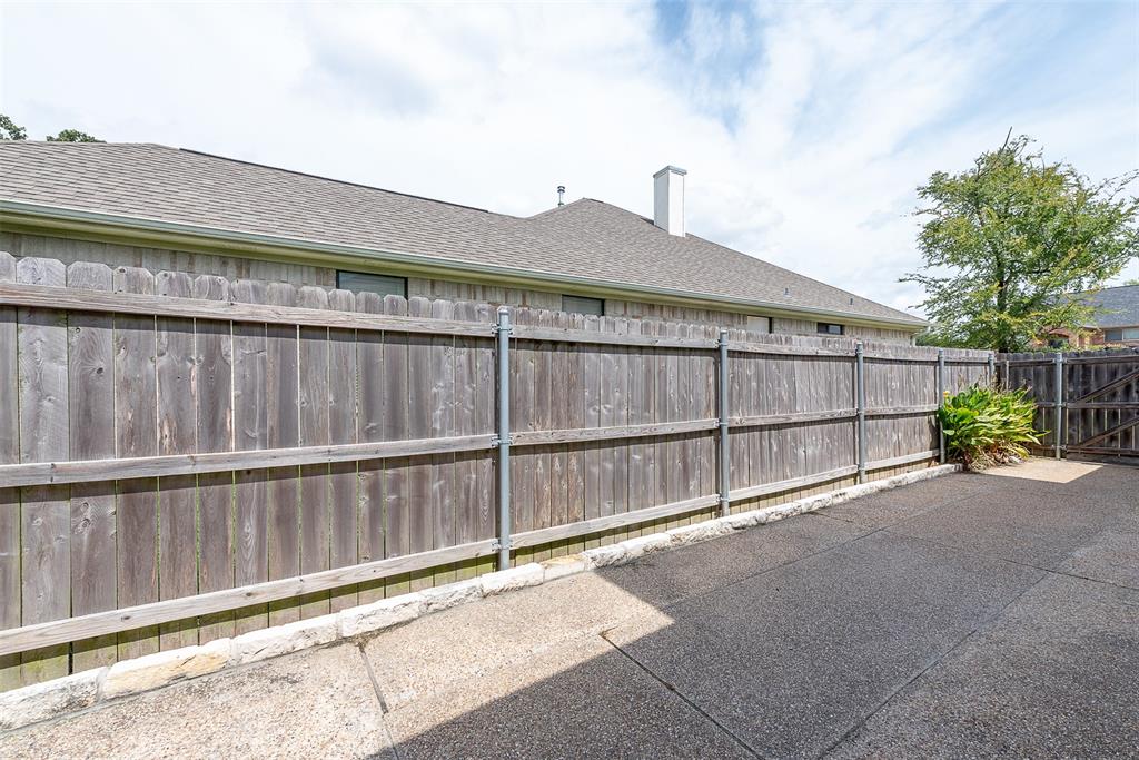 Can someone say "super size" me? Check out these "super-sized" paved sidewalks that line each side of the home, leading to its "super-sized" backyard.