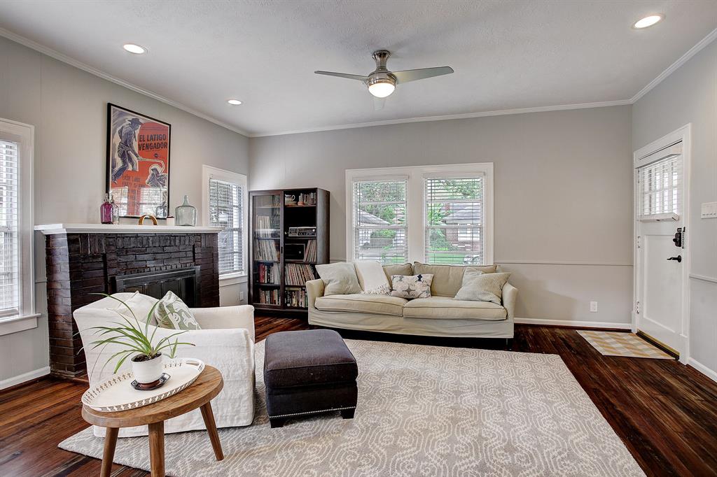 Enter into the living room complete with a wood burning fireplace, gorgeous hardwood floors and lots of windows.  Essentially the entire interior of this home was re-done after the sellers purchased it in 2016.