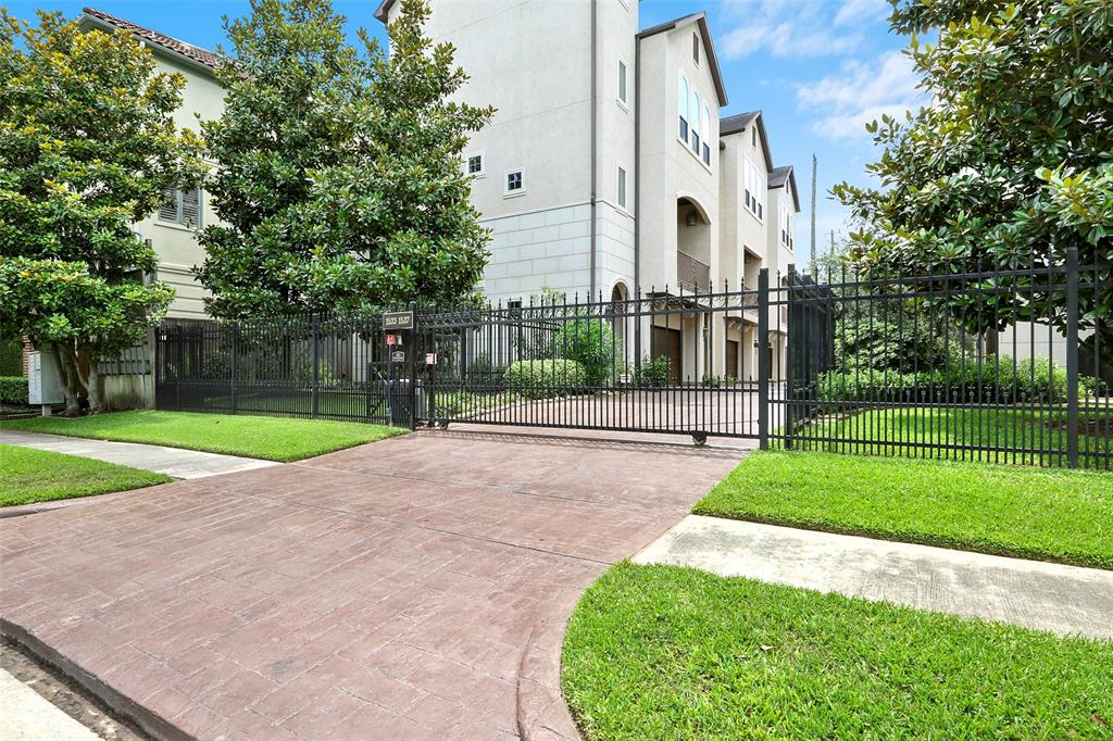 End-unit patio home in a gated community with a fenced yard.