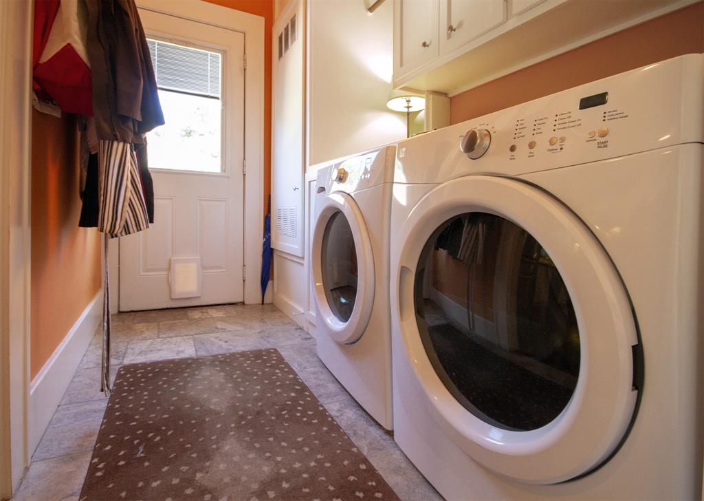 Convenient laundry room and access to outdoors with pet door