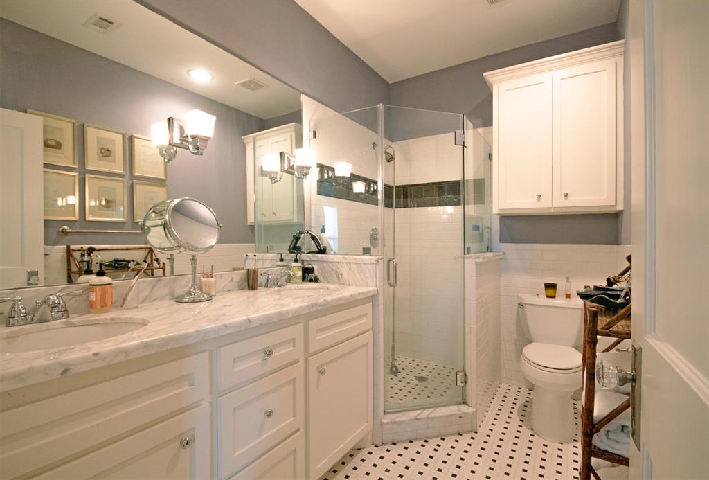 Luxurious updated en-suite Master Bathroom with double-sinks and walk-in shower