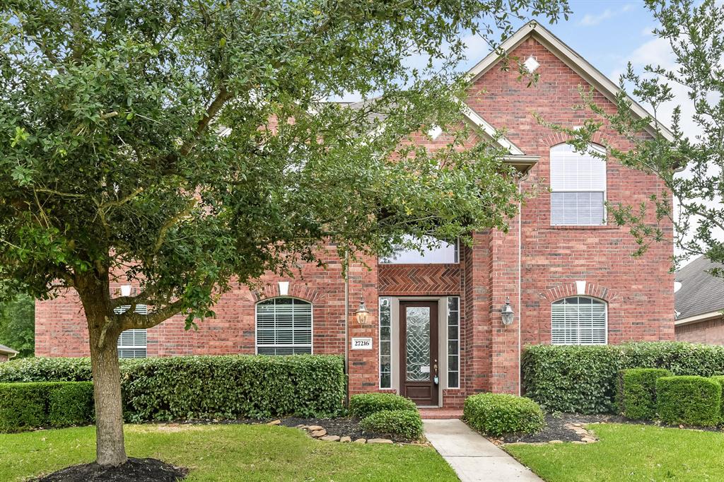 27216 Shauna Lane Spring, Texas This home features: vaulted ceiling entryway, fireplace, eat-in kitchen with double sink, breakfast bar and an abundance of cabinetry. The second floor includes a bridge-like balcony path to a loft, large comfortable bedroom, master bath has garden tub and a separate glass shower. Exterior features comprise a beautiful brick facade, a detached 2-car garage, and a big backyard.