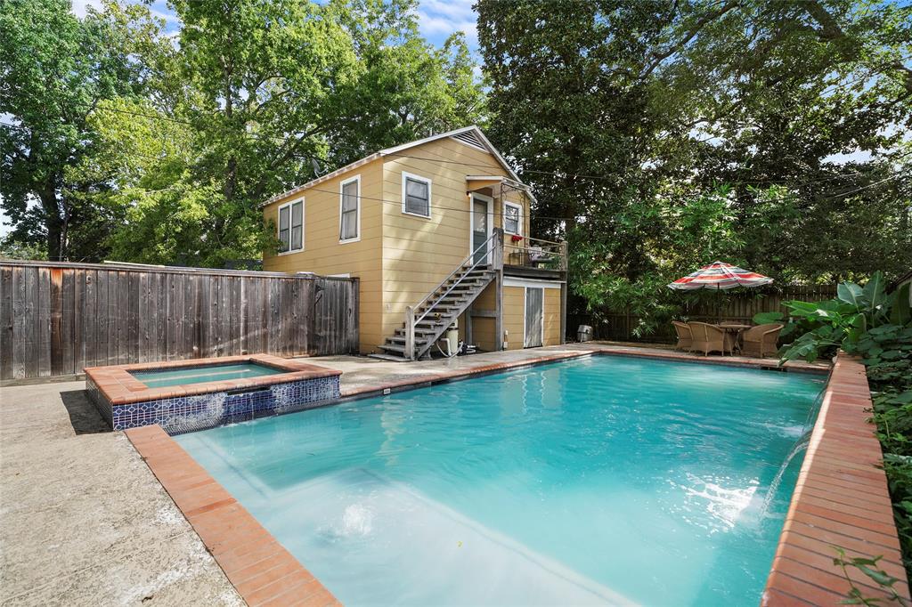 Cool off in the pool and relax in the hot tub.  The over-sized lot provides plenty of space for the pool and garage apartment.