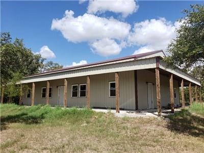 1781 COUNTY ROAD 419 Yoakum, Texas This property won't last long! Enjoy living in the quaint 1 bedroom, 2 bath house while you finish the 2240+/- sq. ft. Barndominium. Plumbing is in and interior framing and drywall have begun! This is the perfect opportunity to customize it and make it your own in half the time of building from the ground up!
23+/- Wooded acres create the perfect habitat for wildlife, while the separated pastures make containing and rotating livestock a breeze. Behind the small house are 2 RV spots with hookups. There is a detached garage with a shop also located next to the smaller home. Too many perks and details to list...
This property is a MUST SEE! Call today!
